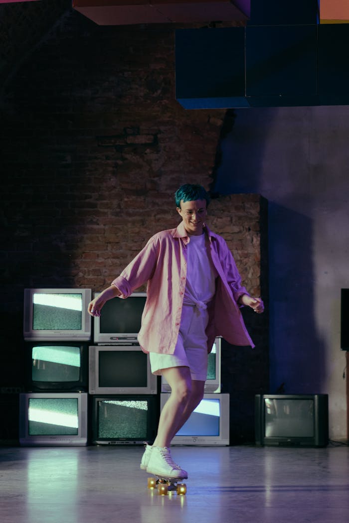 Teen girl with colored hair roller skating indoors near old CRT TVs, exuding fun and retro vibes.